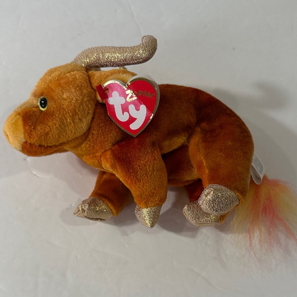 Ty Beanie Baby Zodiak Ox. Tags still on . EUC.  Retired in 2000.